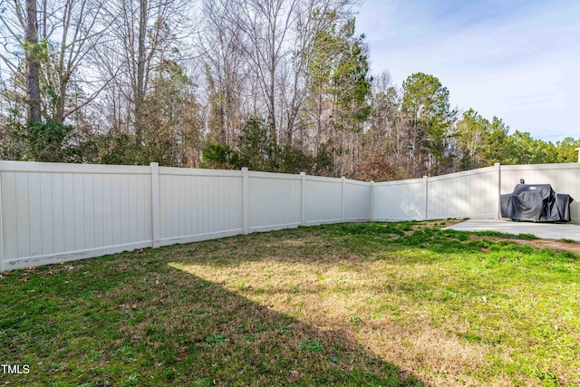 view of yard with a fenced backyard