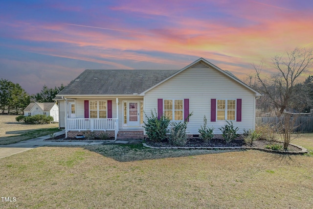 single story home with a porch, a shingled roof, crawl space, and a front lawn