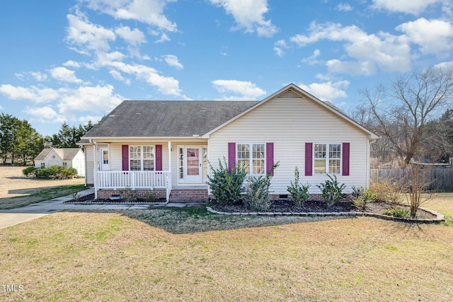 ranch-style house with roof with shingles, covered porch, crawl space, and a front yard