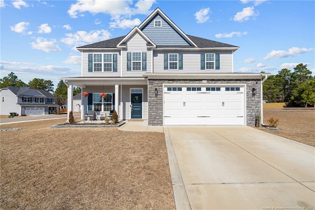 craftsman house with a garage and covered porch