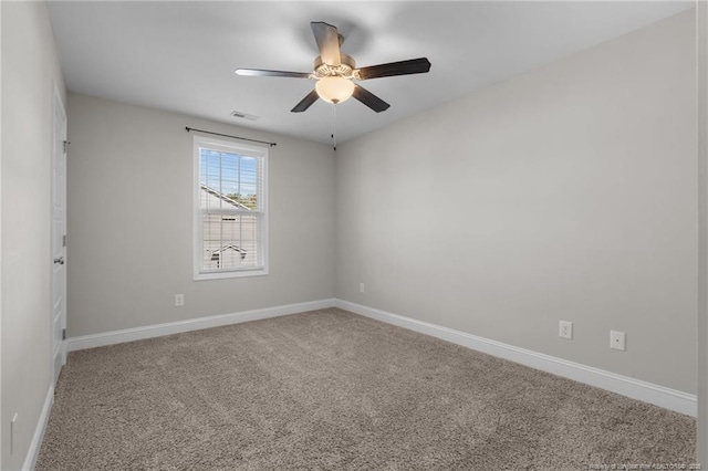 empty room featuring carpet flooring and ceiling fan