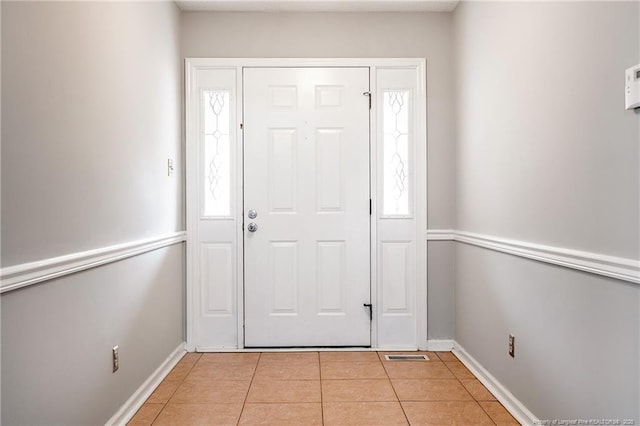 entrance foyer featuring light tile patterned floors