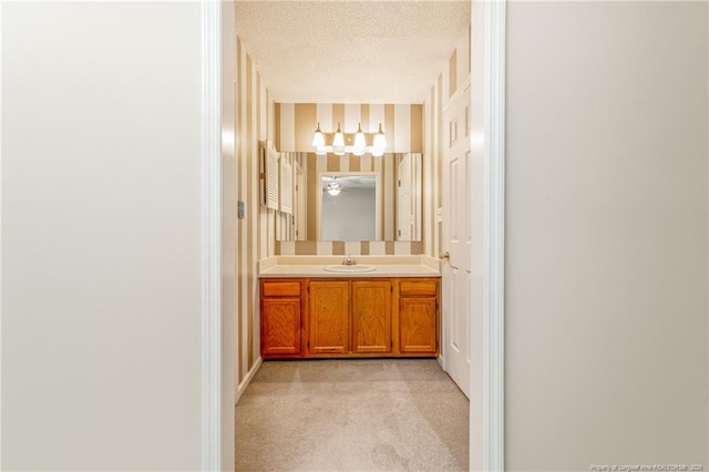 bathroom with vanity and a textured ceiling