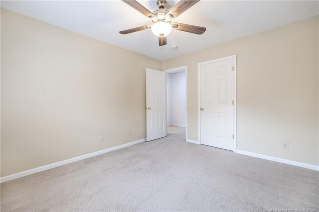 unfurnished room with light carpet and ceiling fan