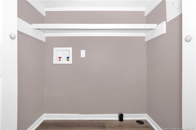 washroom featuring hardwood / wood-style flooring and hookup for a washing machine