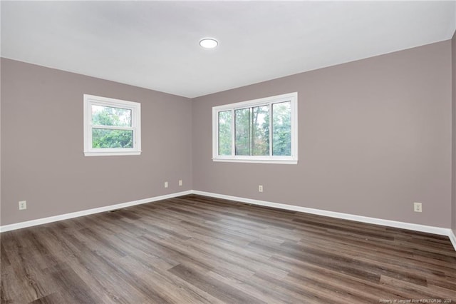 empty room featuring hardwood / wood-style flooring