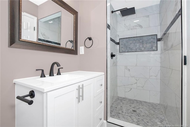 bathroom featuring vanity and a tile shower