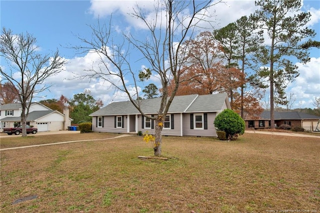 ranch-style home featuring a garage and a front yard