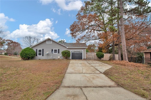 view of front facade with a garage and a front yard