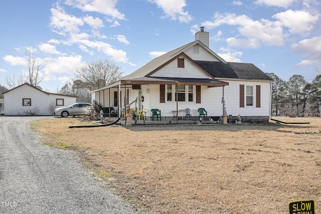 view of front of house featuring a front yard and covered porch