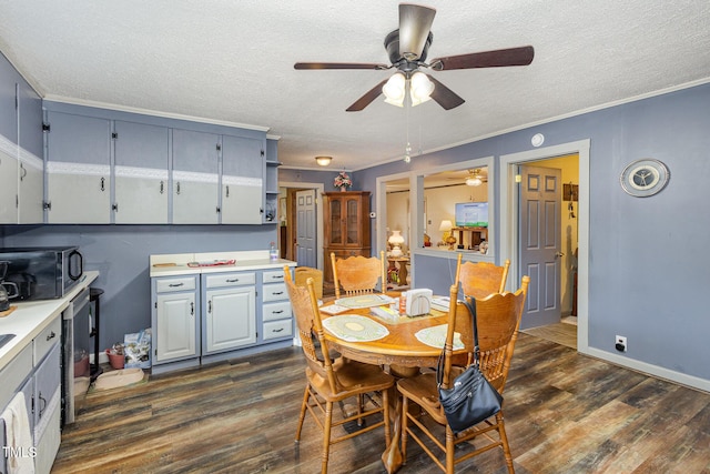 dining space featuring crown molding, dark wood-type flooring, and a textured ceiling