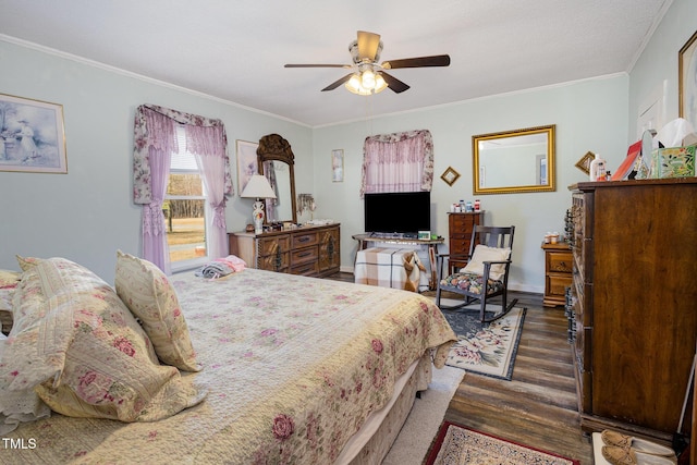 bedroom featuring crown molding, dark wood-type flooring, and ceiling fan