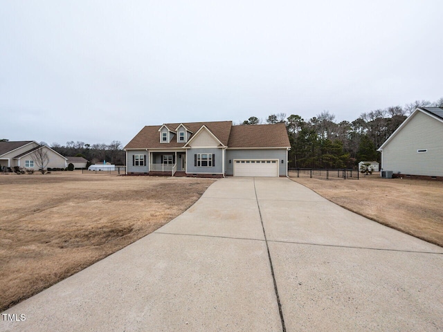 view of front facade with a garage, covered porch, and a front lawn