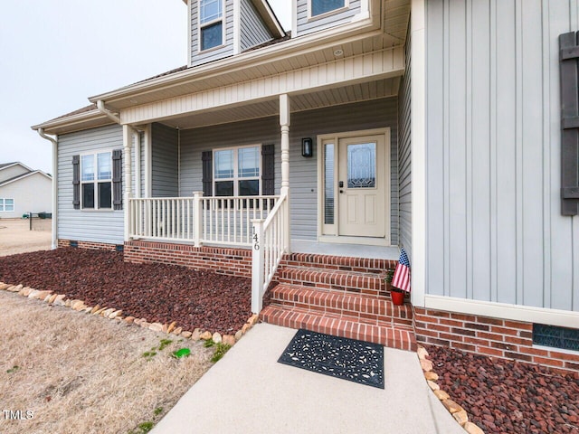 entrance to property featuring a porch