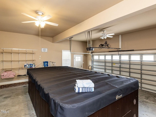 garage featuring a garage door opener and ceiling fan