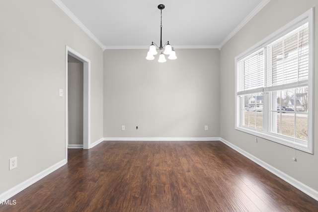 unfurnished room featuring baseboards, a notable chandelier, ornamental molding, and dark wood-type flooring