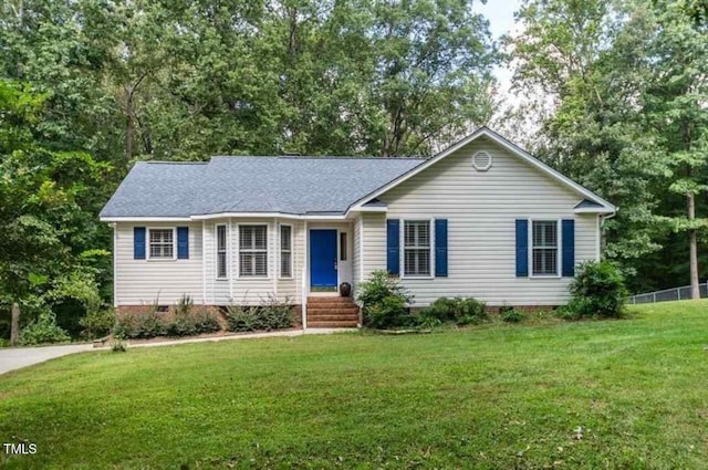 single story home featuring a front lawn