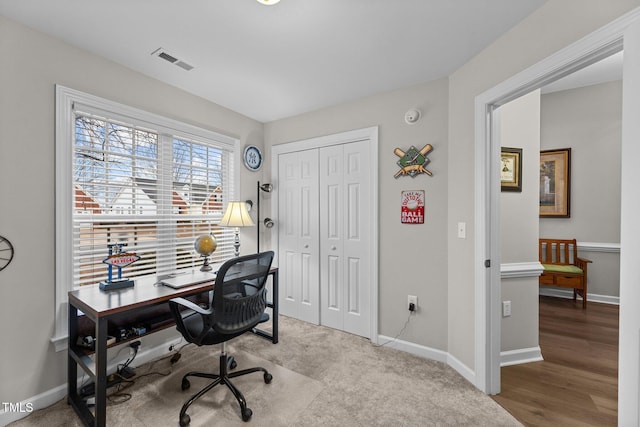 office area featuring visible vents and baseboards