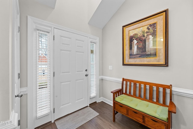 entryway with baseboards, vaulted ceiling, and wood finished floors