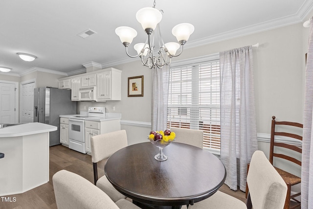 dining space with dark wood-type flooring, a chandelier, visible vents, and ornamental molding