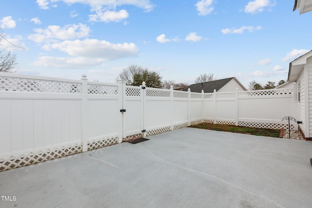 view of patio / terrace with a fenced backyard and a gate