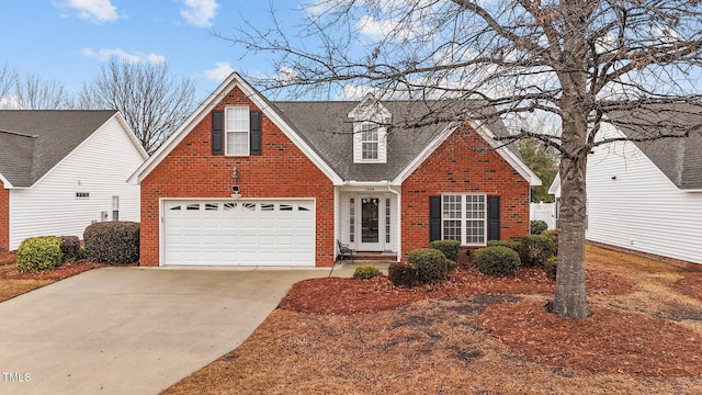 traditional home with a garage, concrete driveway, brick siding, and a shingled roof