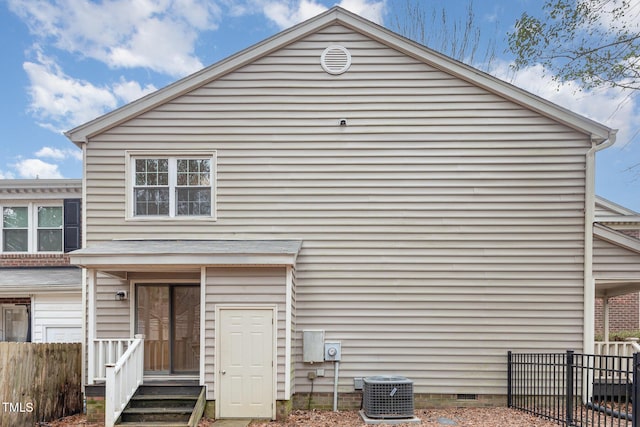 exterior space featuring crawl space, fence, and central air condition unit