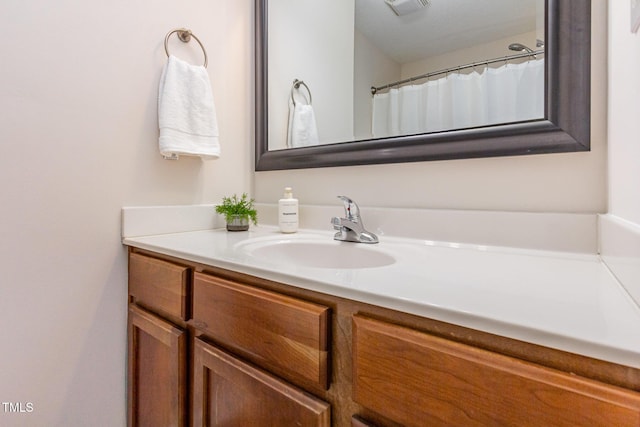 bathroom featuring visible vents and vanity