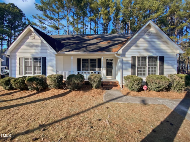 ranch-style home featuring a porch