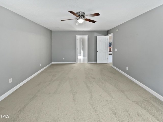 spare room with carpet and ceiling fan