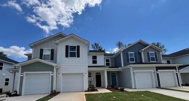 144 Parker Ln, Mebane, NC 27302 - view of front of home featuring board and batten siding, an attached garage, and driveway