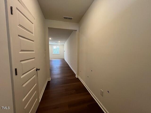 144 Parker Ln, Mebane, NC 27302 - hall with visible vents, baseboards, and dark wood finished floors