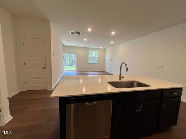 144 Parker Ln, Mebane, NC 27302 - kitchen with stainless steel dishwasher, an island with sink, dark wood finished floors, visible vents, and a sink