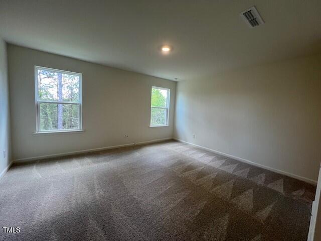 144 Parker Ln, Mebane, NC 27302 - spare room featuring recessed lighting, carpet, visible vents, and baseboards