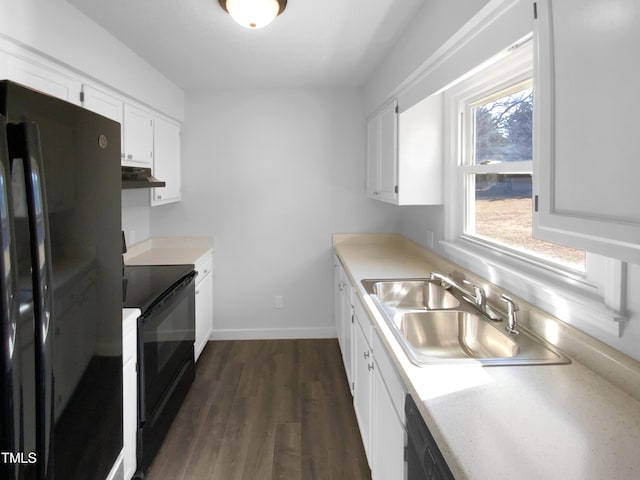 kitchen featuring dark wood-type flooring, white cabinets, sink, and black appliances