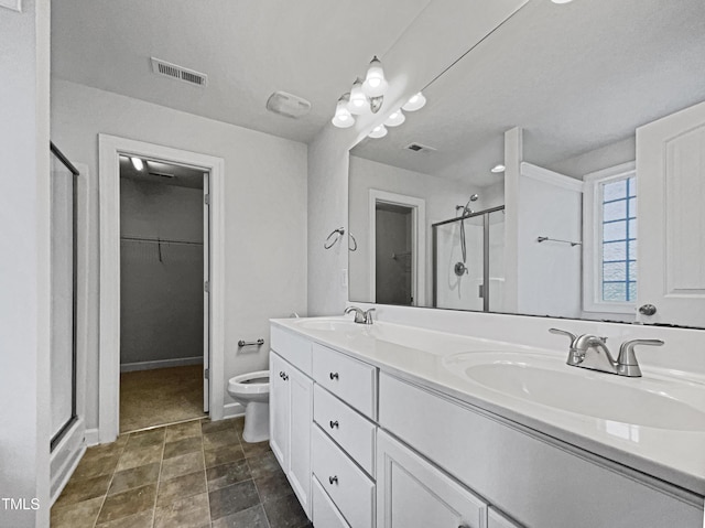 bathroom with an enclosed shower, vanity, and toilet