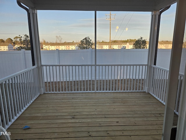 unfurnished sunroom with a healthy amount of sunlight