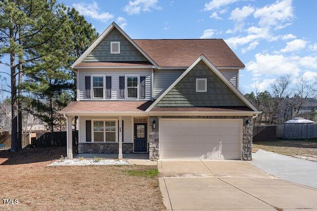 craftsman-style house featuring a garage and covered porch