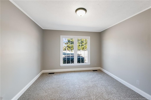 empty room featuring crown molding, a textured ceiling, and carpet flooring