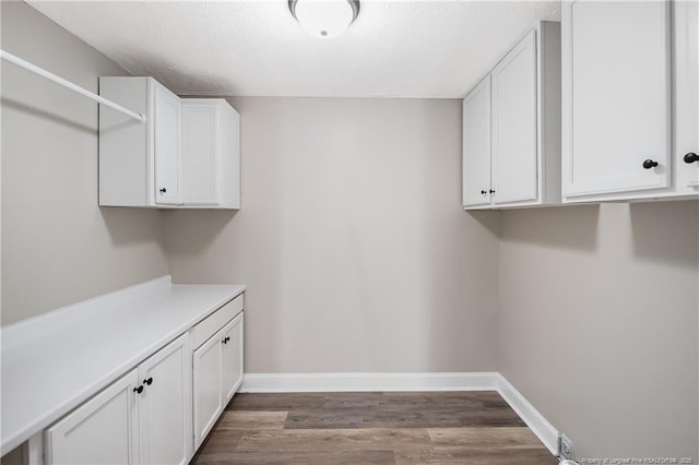 laundry area featuring dark hardwood / wood-style floors