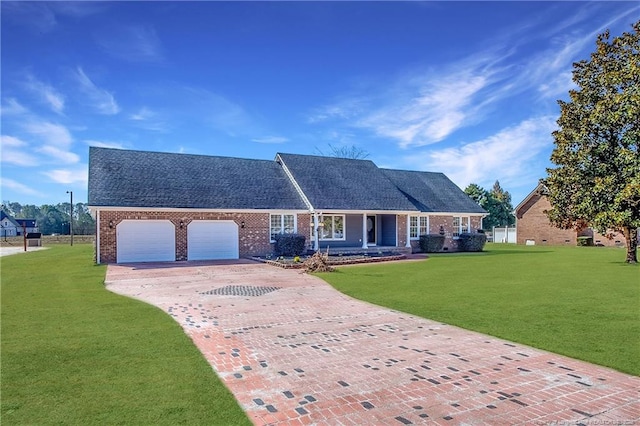 single story home featuring a garage and a front lawn