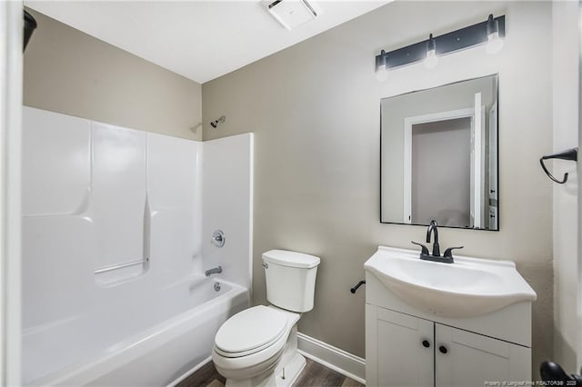 full bathroom featuring vanity, bathtub / shower combination, hardwood / wood-style floors, and toilet