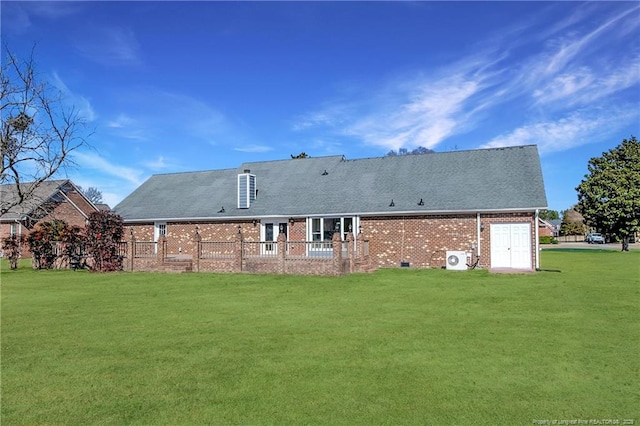 back of house with a lawn