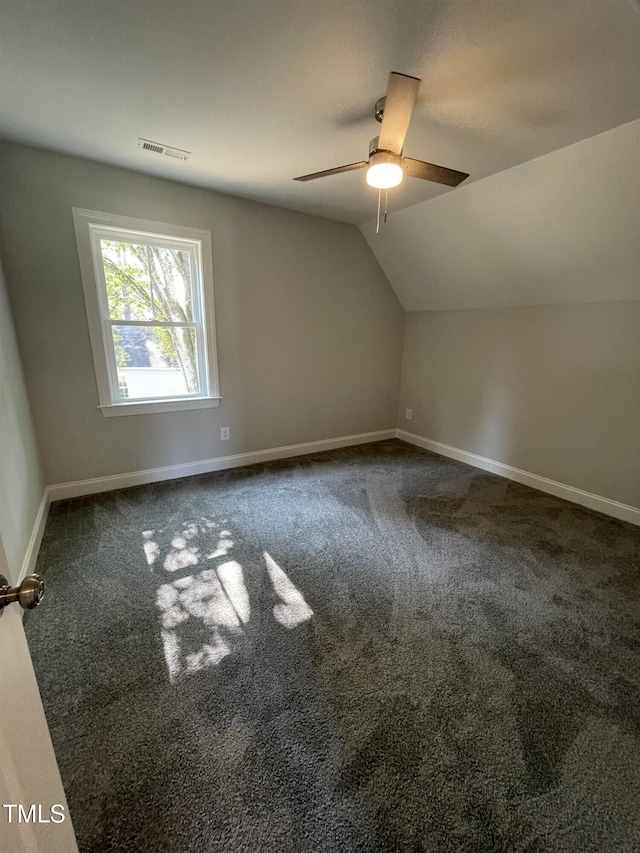 additional living space featuring lofted ceiling, carpet floors, and ceiling fan