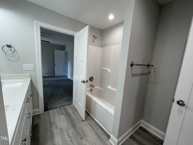 bathroom with vanity, bathing tub / shower combination, and hardwood / wood-style floors