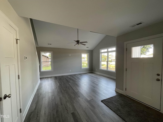 foyer entrance with ceiling fan, dark hardwood / wood-style flooring, and vaulted ceiling