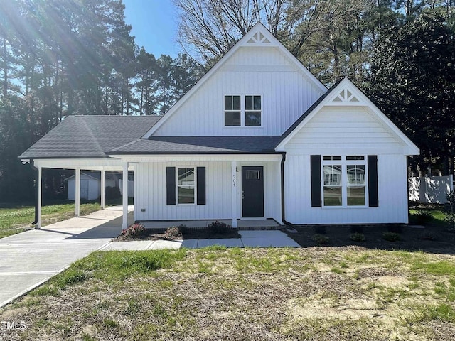 view of front of property with a carport and a front yard