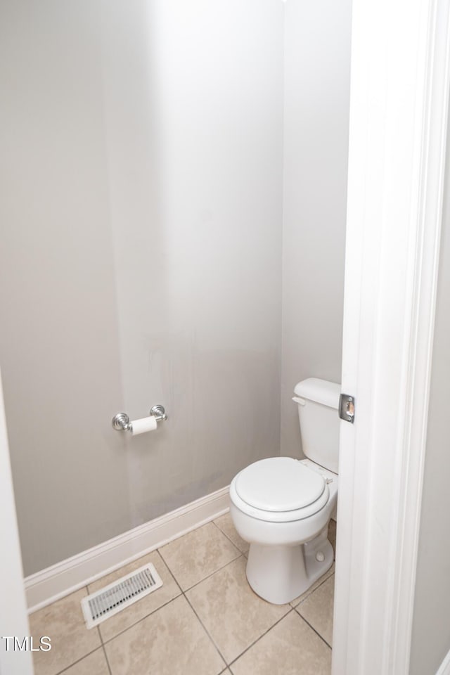 bathroom with tile patterned floors and toilet