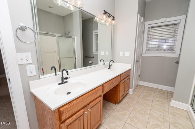 bathroom featuring vanity, tile patterned floors, and a shower with shower door