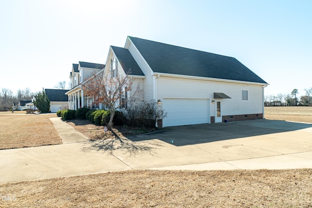 view of side of property with a garage